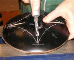 Power carving a design onto a bowl